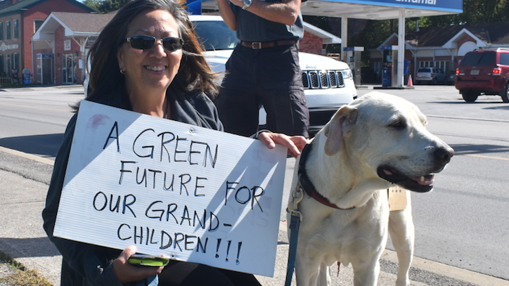 <p>ALL CREATURES GREAT AND SMALL – Eileen Manpili and her dog, Diego, joined the protest on Friday to draw awareness to the effects of climate change. (Sarah Williams/Gazette Staff)</p>
