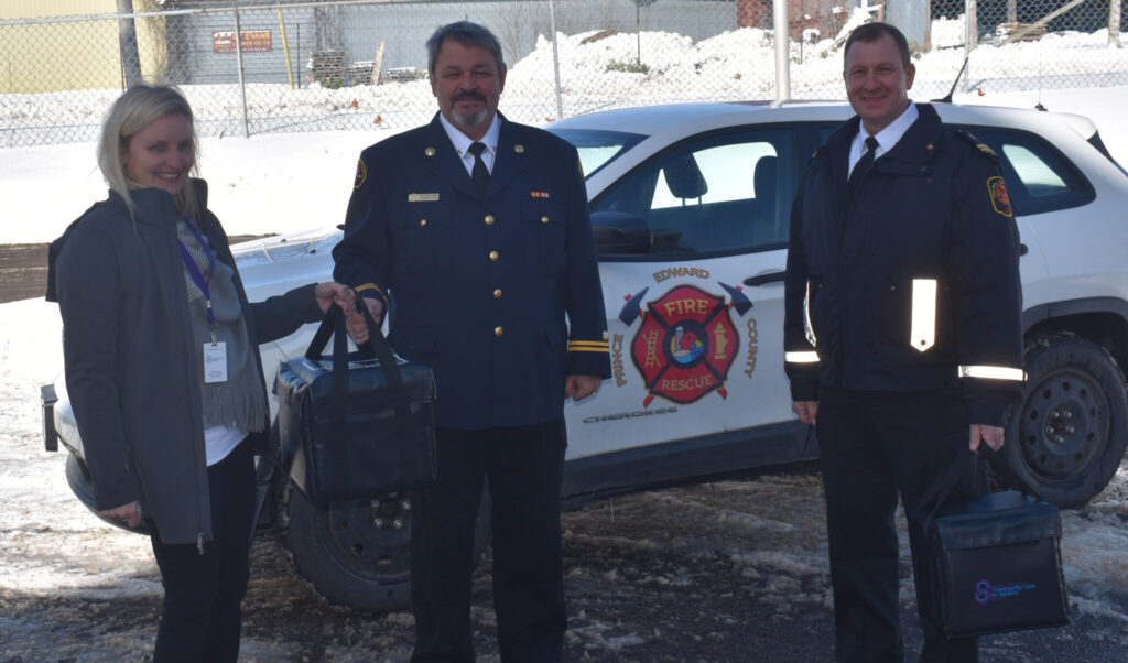 <p>PASTA AND PREVENTION- Community Care for Seniors program coordinator Teresa Shephard and Fire Prevention Officers Mike Branscombe and Greg Gorsline deliver a hot meal to a Meal on Wheels client. (Jason Parks/Gazette Staff)</p>
