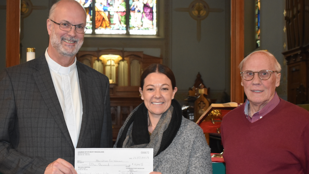 <p>FOR WOMEN IN NEED-Charles Morris, Minister at St. Mary Magdalene’s (LEFT) and Church Warden Herb Stone (RIGHT) present AFW Executive Director Leah Morgan with a cheque for  $15,000. (Sarah Williams/Gazette Staff)</p>

