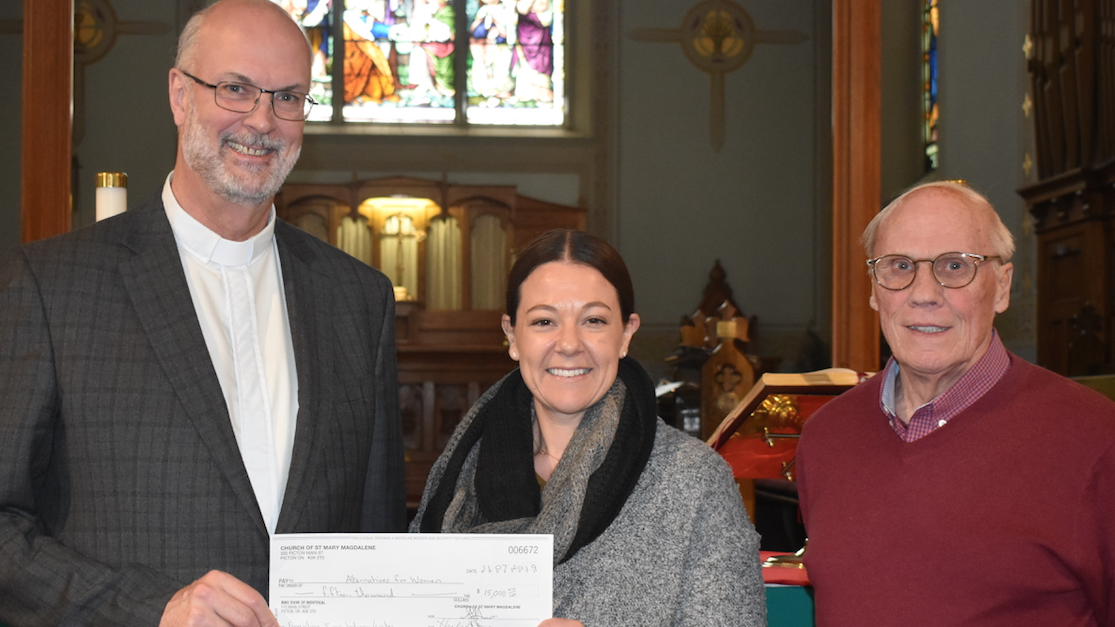 <p>FOR WOMEN IN NEED-Charles Morris, Minister at St. Mary Magdalene’s (LEFT) and Church Warden Herb Stone (RIGHT) present AFW Executive Director Leah Morgan with a cheque for  $15,000. (Sarah Williams/Gazette Staff)</p>
