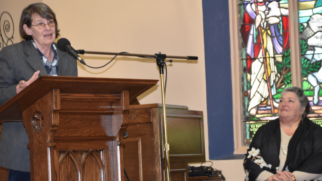 <p>WORDS FROM MANY VOICES – Local author Janet Kellough presents her thoughts on Moon of the Crusted Snow by Waubgeshig Rice as organizer Karen Lewis looks on at the One Land, Many Voices presentation at  Andrew’s Presbyterian Church in Picton on Sunday. (Sarah Williams/Gazette Staff)</p>
