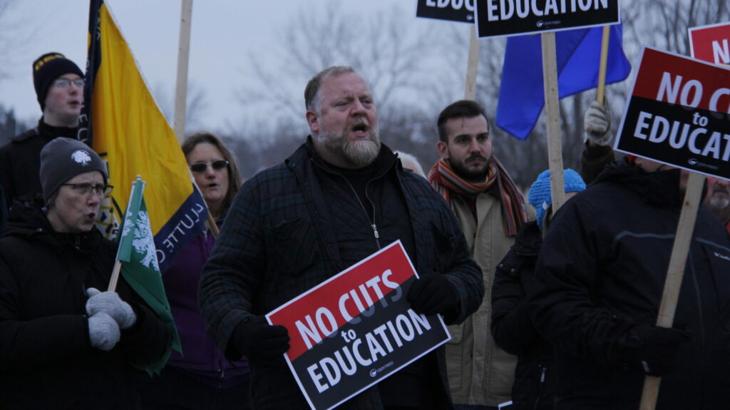 <p>SPEAKING OUT – A supportive protester chanted “shame” and “boo” at Thursday afternoon’s rally in front of Bay of Quinte MPP Todd Smith’s office. The peaceful demonstration attracted around 70 people concerned over cuts being made in the public school system. (Desirée Decoste/Gazette Staff)</p>
