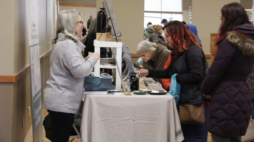 <p>HANDMADE ARRAY – At the 28th annual “Handmade” Christmas Craft Show in Wellington, (left) Lisa Robertson, owner of Rebel Soul Design displayed and expressed her love of her art pieces of handcrafted silver jewelry to her customers. (Desirée Decoste/Gazette Staff)</p>
