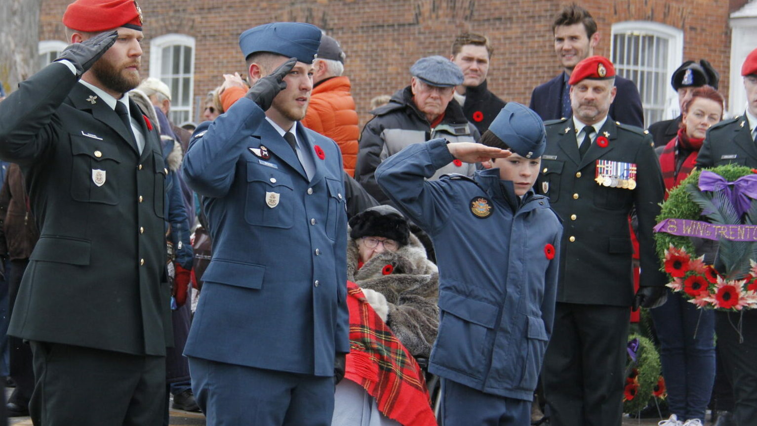 <p>Canadian Forces members and a member of the 851 Air Cadet squadron salute after laying wreaths at the Wellington Remembrance Day ceremony. (Desirée Decoste/Gazette Staff)</p>
