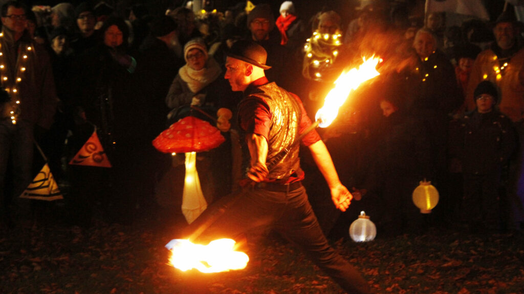 <p>Illuminating A fire thrower performs at the 2019 Firelight Lantern Festival organized by the Department of Illumination. (Desirée Decoste/Gazette file photo)</p>
