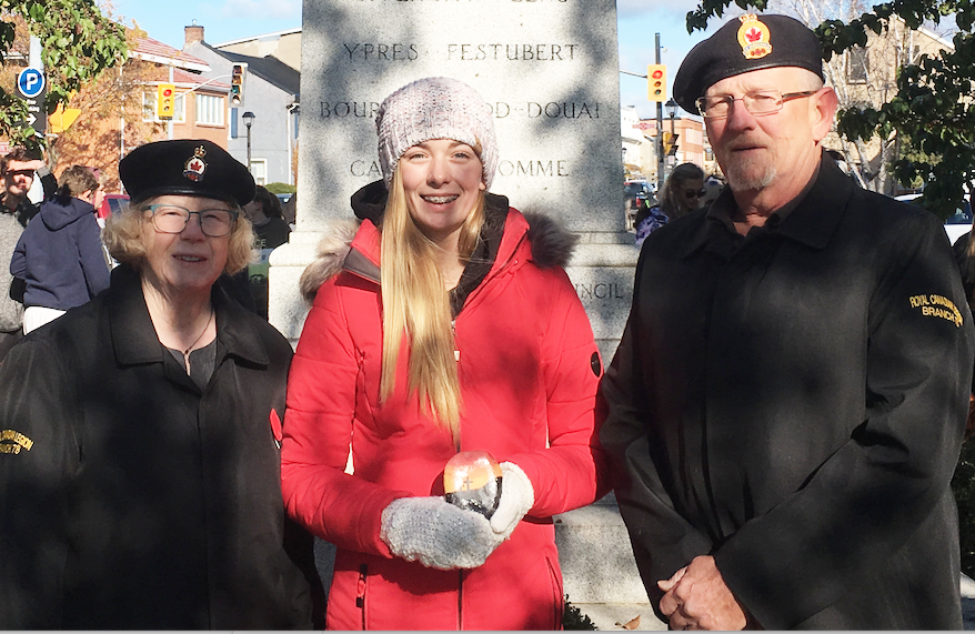 <p>PECI REMEMBERS &#8211; (L-R) Diane Kennedy, President of Branch 78 Legion stands beside PECI student Lily Anderson and Poppy Chairman, Tom McCaw during an act of commemoration by local elementary students Friday afternoon. (Sarah Williams/Gazette Staff)</p>
