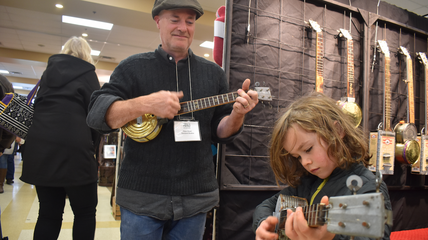 <p>STRUMMING AWAY- Ross Stuart of Rossland Studios and Wilfred Miller-Riopelle collaborate on a tune at the 2019 Maker&#8217;s Hand in Wellington on Saturday. (Jason Parks/Gazette Staff)</p>
