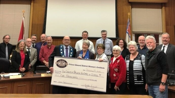 <p>ALL ABOARD – Members of the Prince Edward District Women’s Institute present a cheque for $5,000 to Council during the December 17th Regular Council Meeting. (Submitted Photo)</p>
