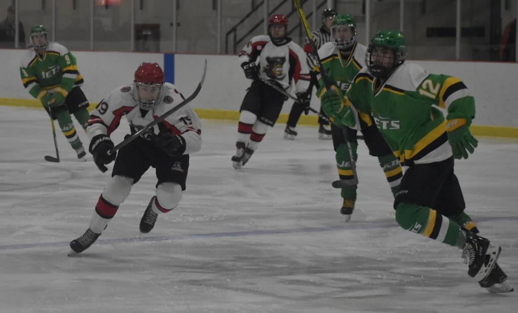 <p>HARD CHARGING- Picton’s Nolan Dawson eyes a loose puck in the Amherstview zone during the Pirates 5-4 win over the visiting Jets Thursday night. (Jason Parks/Gazette Staff)</p>
