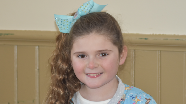 <p>SOPHIASBURGH SATURDAY – Avery Harper takes a break from Christmas tree ring toss to smile for the camera. (Sarah Williams/Gazette Staff)</p>
