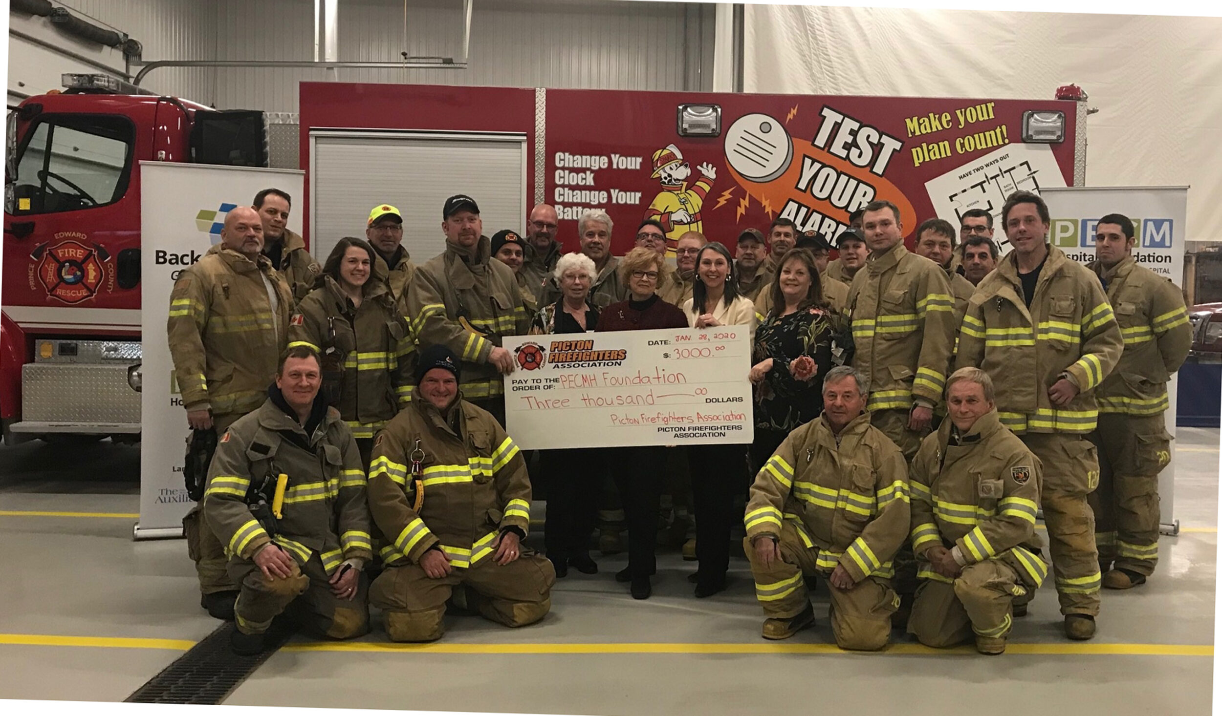 <p>UNSUNG HEROES Volunteers with the Picton Firefighters Association stand with staff and volunteers of the Prince Edward County Memorial Hospital Foundation Tuesday evening at the Picton Fire Hall.<br />
(Briar Boyce for the Gazette)</p>
