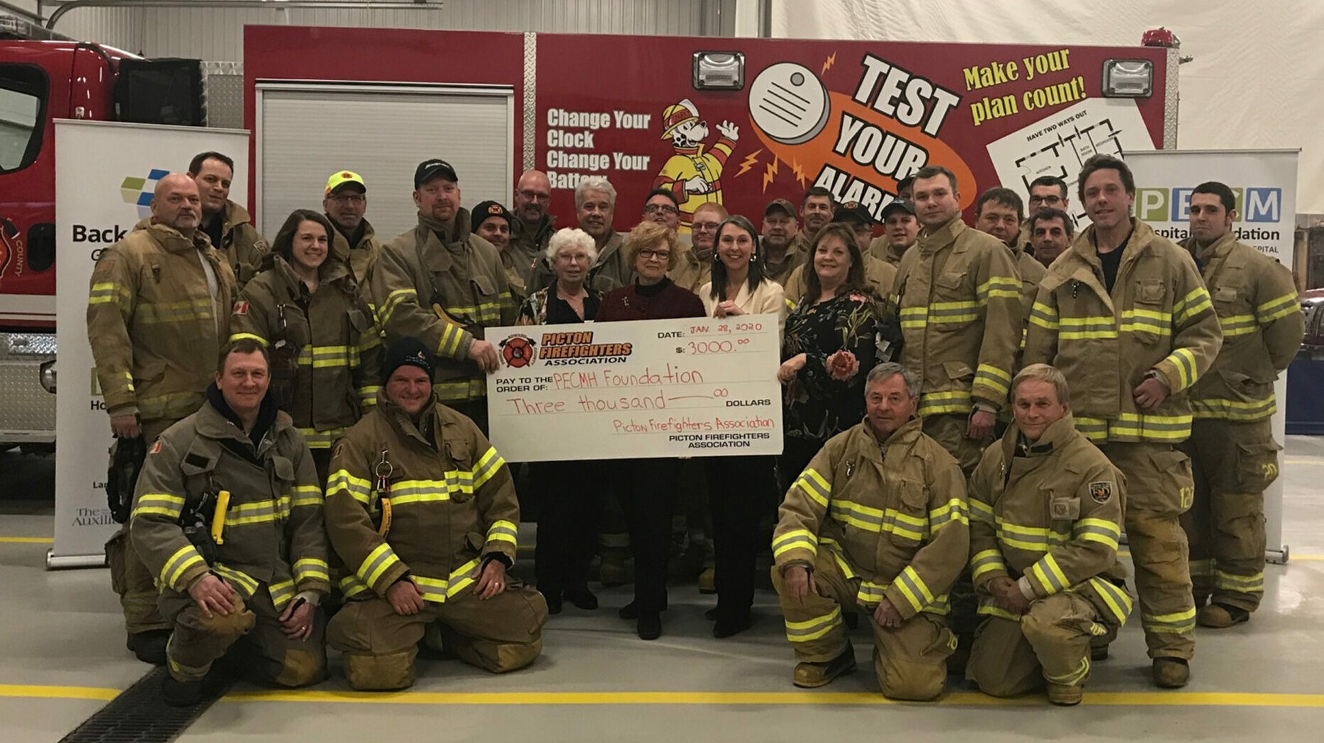 <p>UNSUNG HEROES Volunteers with the Picton Firefighters Association stand with staff and volunteers of the Prince Edward County Memorial Hospital Foundation Tuesday evening at the Picton Fire Hall.<br />
(Briar Boyce for the Gazette)</p>
