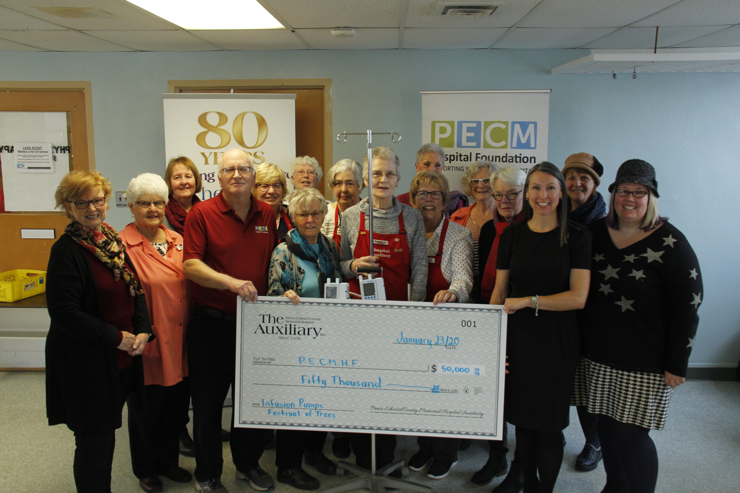 <p>POSING WITH PUMPS- Members of the PECMH Foundation and PECMH Auxiliary posed for a photo in front of two of the new 15 IV Infusion Pumps now in use at PECMH. The PECMH Auxiliary donated $50,000 from the proceeds raised at the 2019 Festival of Trees to the hospital equipment fund. (Desirée Decoste/Gazette Staff)</p>
