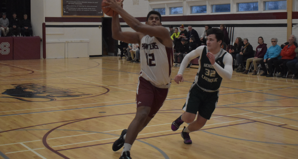 <p>THE A TRAIN- PECI forward Alex Arsenault makes a power move to the Nicholson basket during the Panther’s win over the visiting Crusaders Thursday. (Jason Parks/Gazette Staff)</p>
