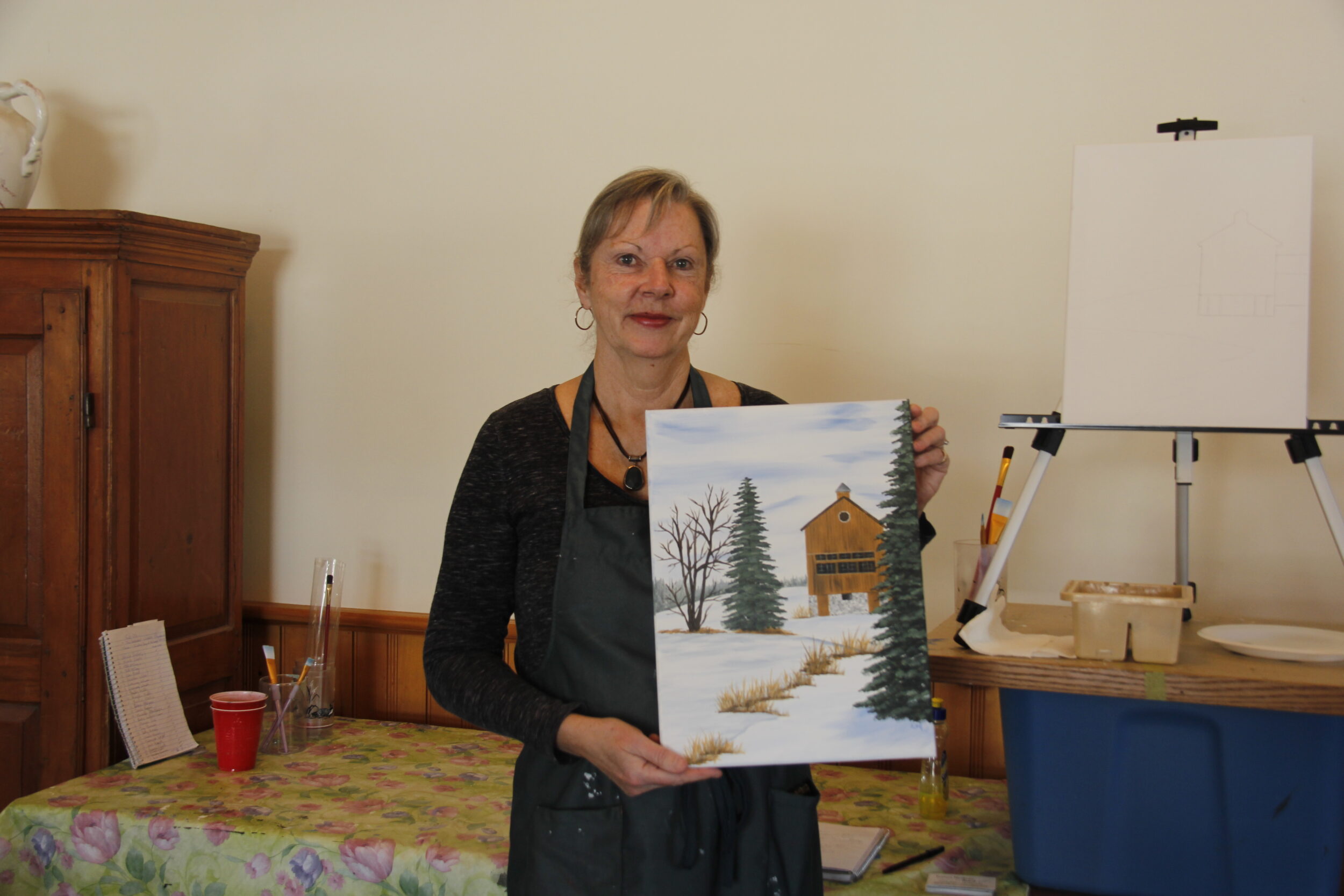<p>SCENIC VIEW<br />
Luanne Hartman holds one of her pre-painted paintings of The Grange for her event Paint ‘n Pour at The Grange as part of the Flashback February celebrations. (Desirée Decoste/Gazette Staff)</p>
