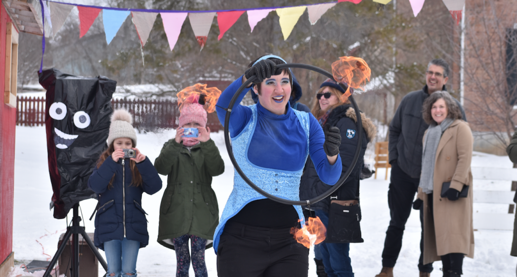 <p>RING OF FIRE Pictured is Tegan Moss of Trellis Arts & Entertainment bringing warmth to an otherwise sub-zero Saturday.  Moss performed during the second and final weekend of the Department of Illumination’s Ice Box outdoor art event. (Sarah Williams/Gazette Staff)</p>
