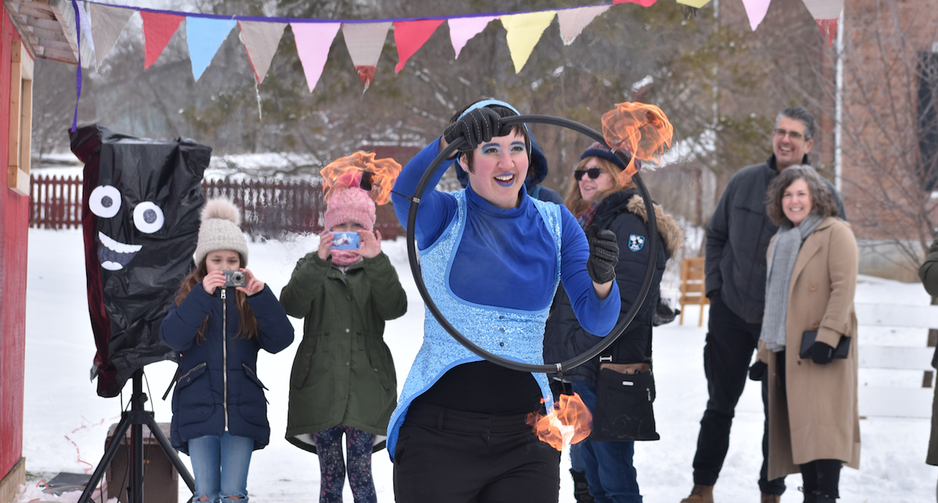 <p>RING OF FIRE Pictured is Tegan Moss of Trellis Arts &#038; Entertainment bringing warmth to an otherwise sub-zero Saturday.  Moss performed during the second and final weekend of the Department of Illumination’s Ice Box outdoor art event. (Sarah Williams/Gazette Staff)</p>
