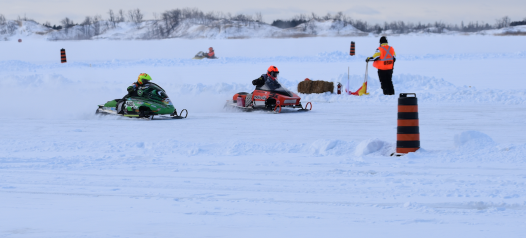 <p>MAKING THE TURN (From left) William Maccormack and Jake Cowden pilot their sleds along West Lake in the  Junior Modified division of the 2020 Sand Dunes Cup Saturday. (Sarah Williams/Gazette Staff)</p>
