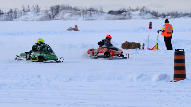 <p>MAKING THE TURN (From left) William Maccormack and Jake Cowden pilot their sleds along West Lake in the  Junior Modified division of the 2020 Sand Dunes Cup Saturday. (Sarah Williams/Gazette Staff)</p>

