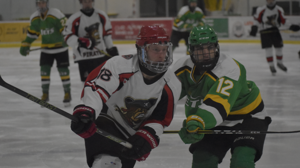 <p>Picton’s Tristan Cowan pushes past Amherstview’s Nick Vecchiarelli during the Pirates’ 3-2 overtime win Thursday. (Jason Parks/Gazette Staff)</p>
