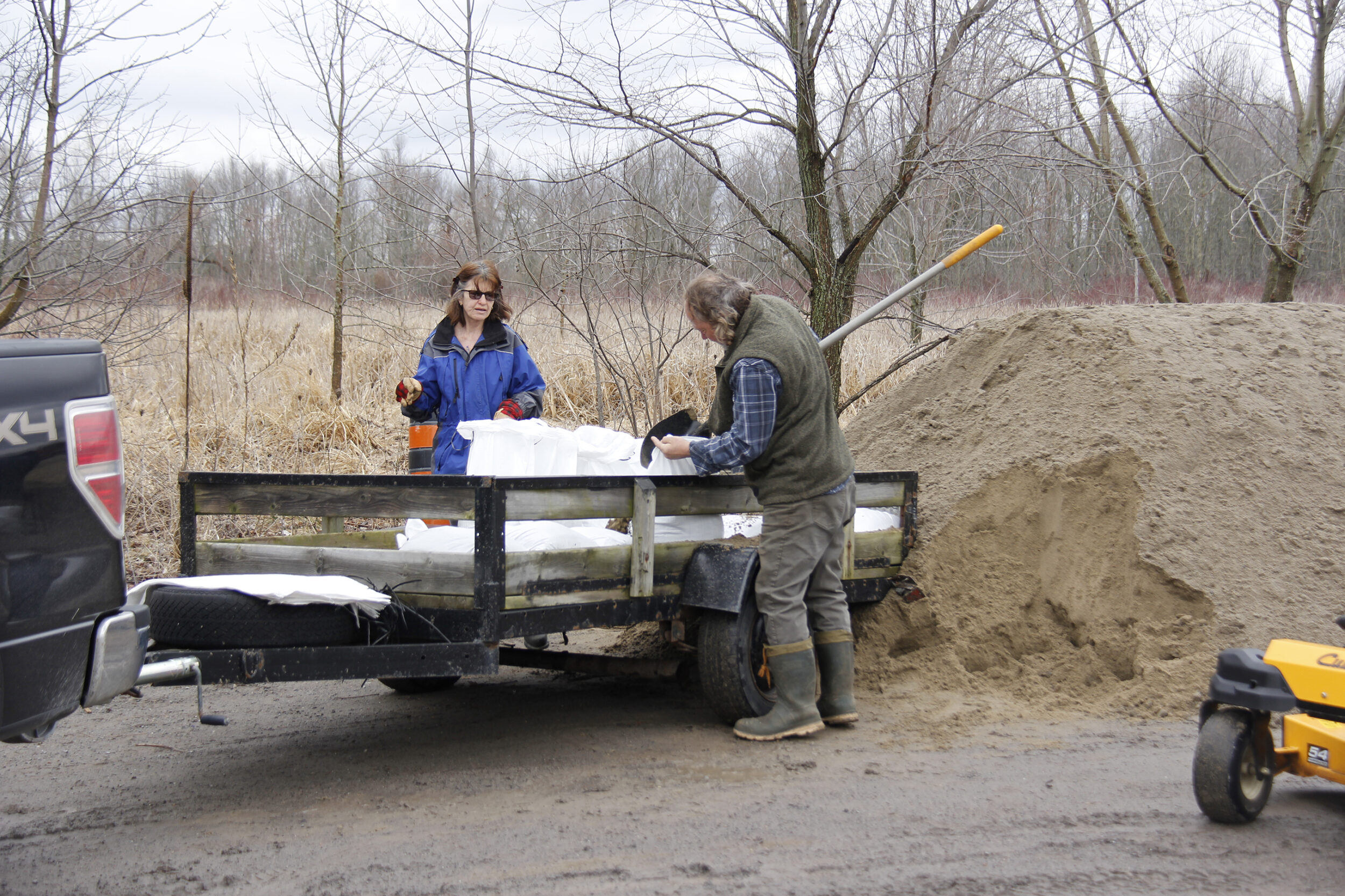 <p>PREPARED Andy and Lynn Moreau fill sand bags at the Hiscock Shores Road sandbagging station on Tuesday. The County of Prince Edward has set up a handful of such stations around the municipality.  (Desirée Decoste/Gazette Staff)</p>
