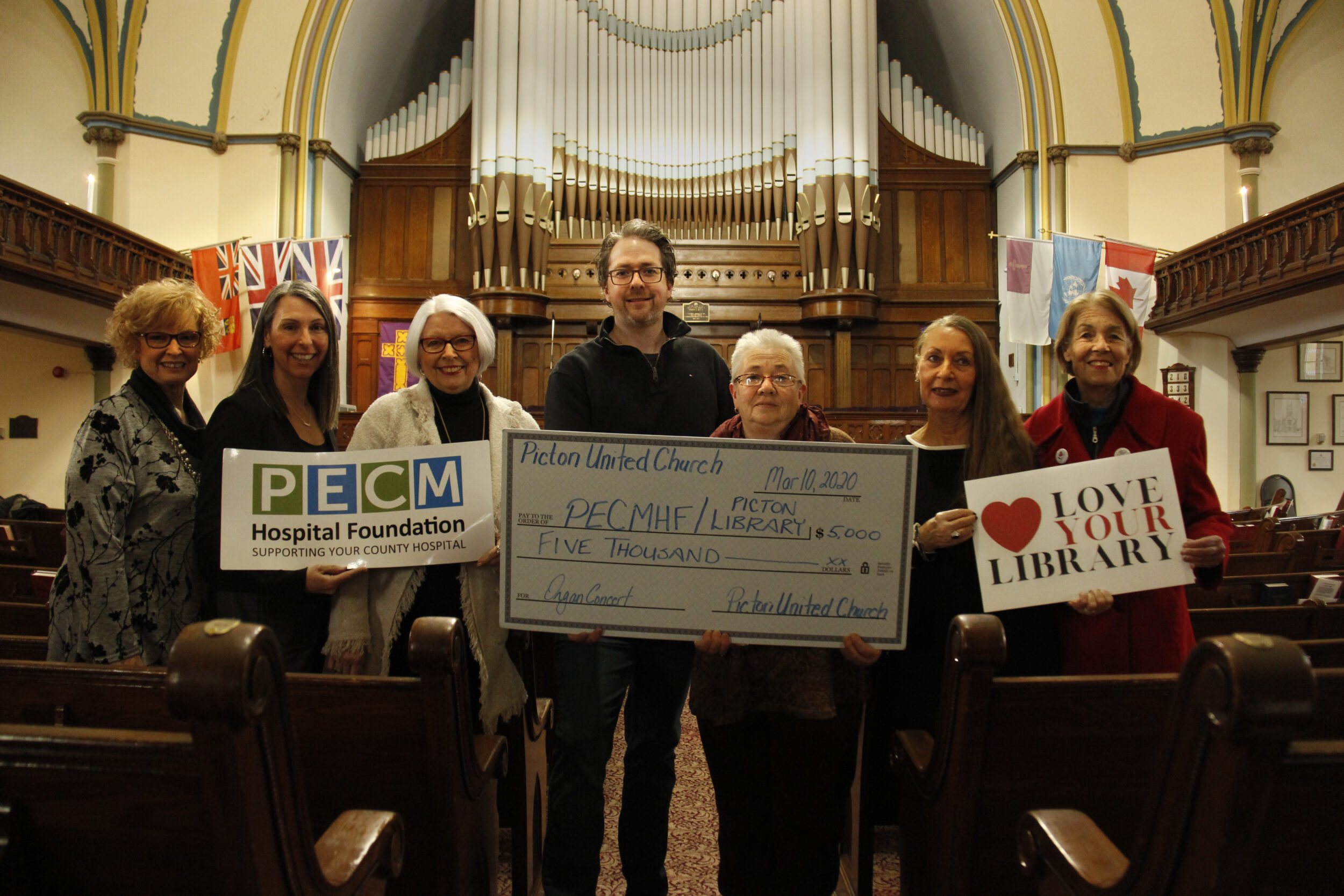 <p>MUSIC TO THEIR EARS Pictured in front of the historical organ at the Picton United Church from left, are Barbara McConnell, chair of the PECMH Foundation, Shannon Coull, executive director of the PECMHF, Sandra Foreman, PECMHF board member and sponsor of the event, Tim McGinnis, Picton United Church member and event organizer, Debra Marshall, chair of the Picton United Church executive committee, Barbara Sweet and Devon Jones on behalf of the Picton Library. (Desirée Decoste/Gazette Staff)</p>
