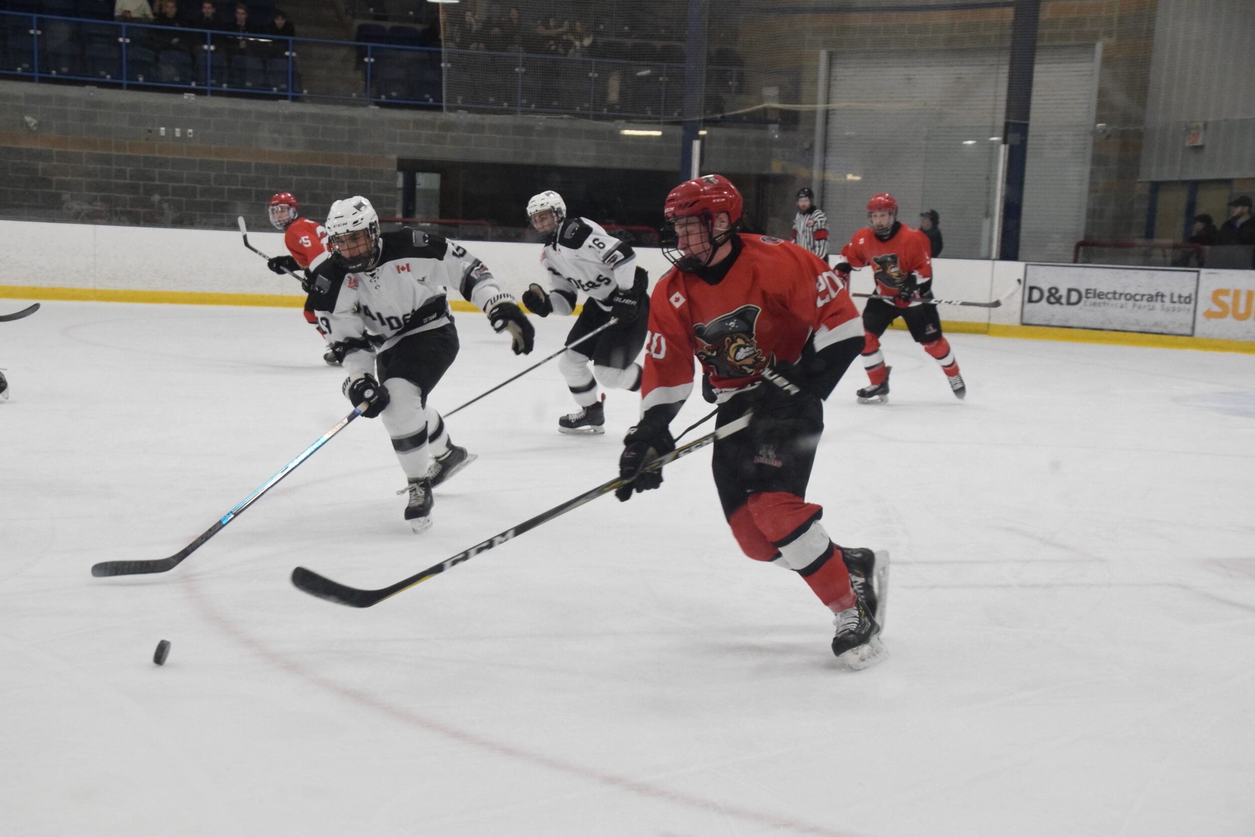 <p>Picton Pirate defenceman Jacob Dietz tries to escape his end while being pursued by Napanee Raider Liam Mroueh. After dropping Game 1 of the Tod Division finals, the Priates and Raiders meet in Game 2 in Picton on Thursday. (Adam Prudhomme/Napanee Beaver)</p>

