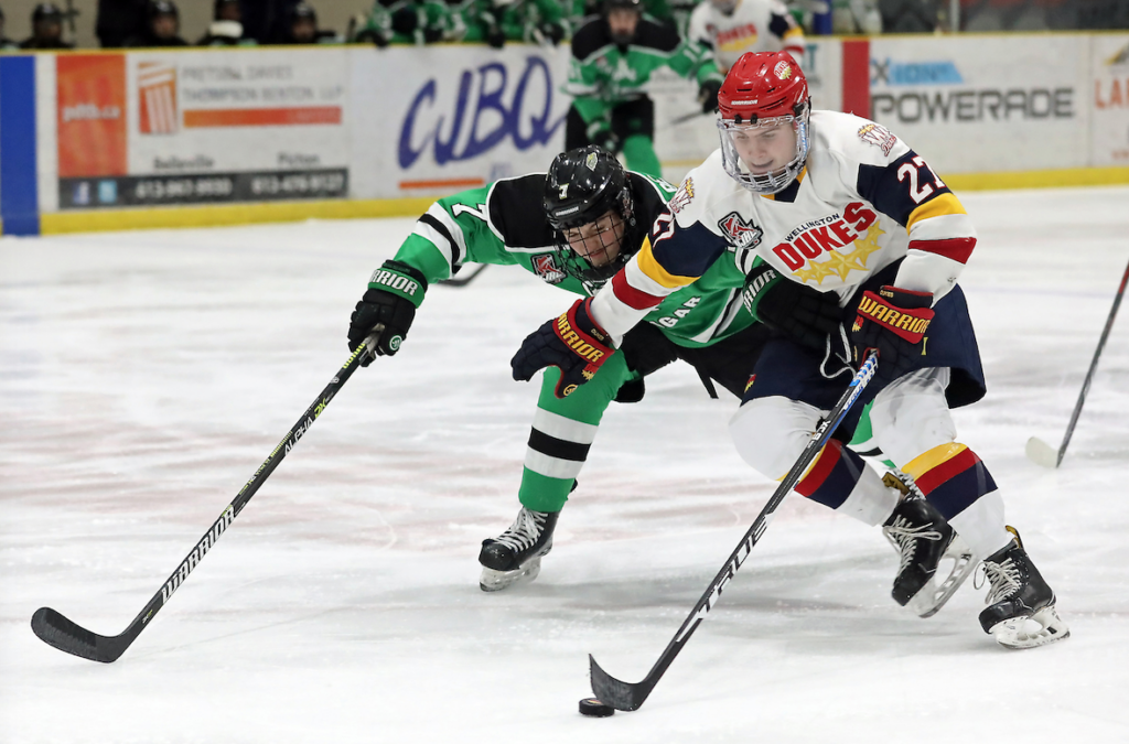 <p>Wellington’s Jake Gagnon tries to get around Darren Beattie of the Cobourg Cougars. Gagnon and the Dukes will host the Trenton Golden Hawks in the 2020 East Division finals at Lehigh Arena Friday night. (Ed McPherson/OJHL Images)</p>
