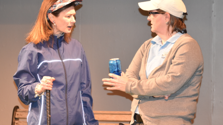 <p>THAT’S GOLF – (L-R) Kim Kennedy plays Tate, pictured here in conversation with her golfing friend, Margot, played by Susie Mitchell. (Sarah Williams/Gazette Staff)</p>
