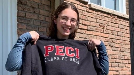 <p>SCHOOL SPIRIT- Anne-Sophie Vaillant, the final student to participate in the Rotary Youth Exchange Program through the Rotary Club of Picton, beams as she holds up a PECI grad sweatshirt gifted to her by the local secondary school. (Submitted Photo)</p>

