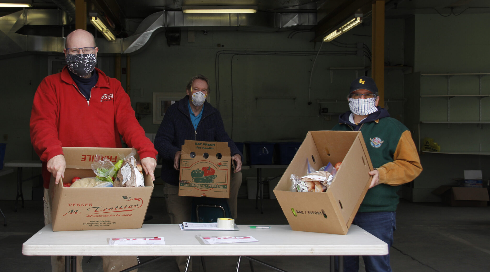 <p>TOGETHER BUT APART (left to right) Braydon Scully manager of the new Food Depot, Tony Walton project manager of the Food Depot and The County Foundation’s communications lead, and Elis Ziegler chair of the Picton Town Hall Board of Management stood with masks on and a good social distance apart as they distributed food on Friday from 12-3 p.m. at the new Food Depot in the old firehall at the Picton Town Hall. Food will be distributed every Friday for those in need. (Desirée Decoste/Gazette Staff)</p>
