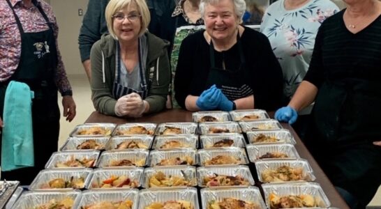 <p>FOOD FOR ALL – Members of Food to Share prepare food earlier in the year for those in need (Submitted Photo).</p>
