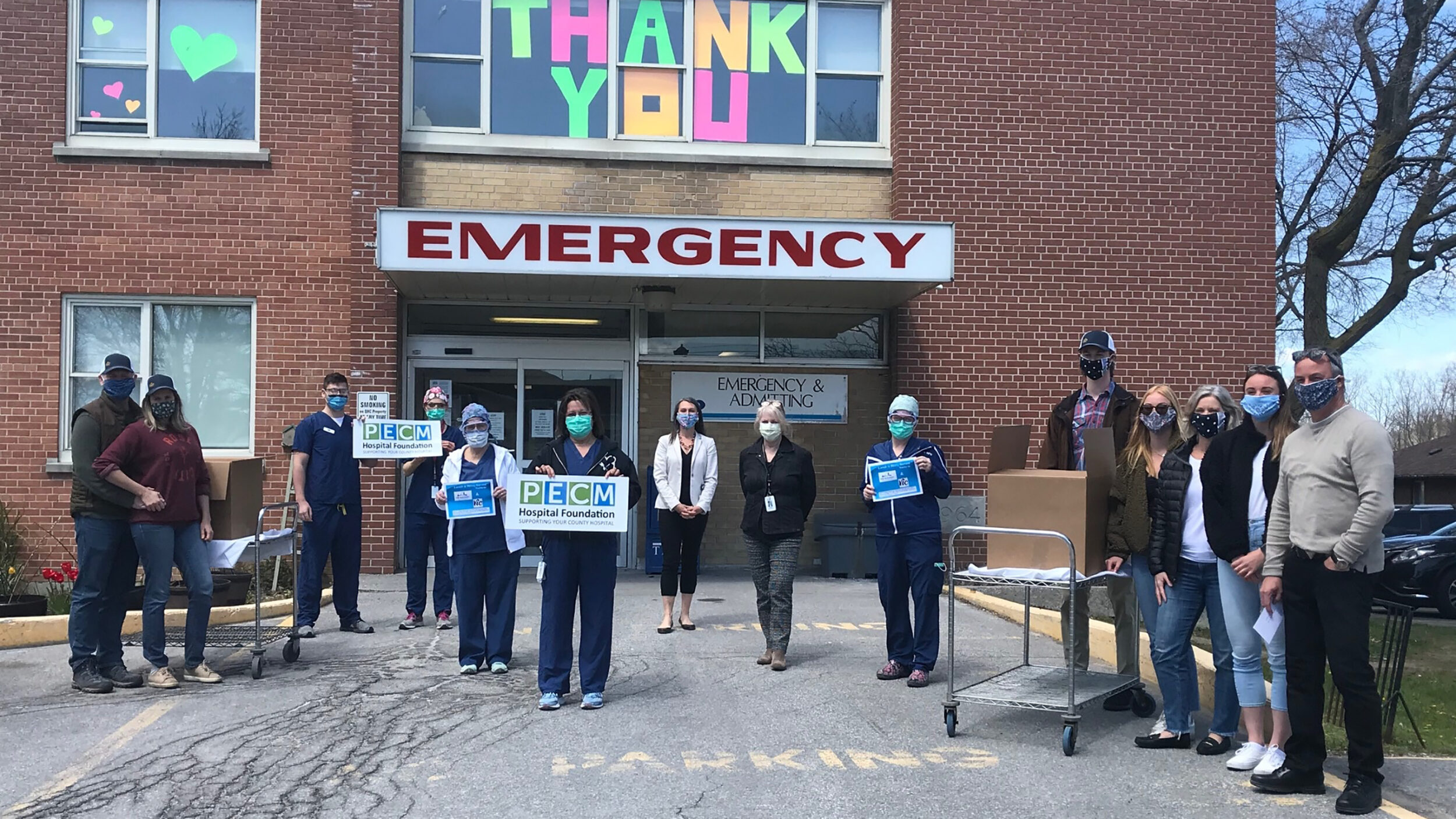 <p>LUNCH IS SERVED Tim and Judy McKinney with their three children (gathered at right) stand with frontline workers at PECMH. Rick and Sonya Szabo, owners of the Vic Café are at left.(Submitted photo.)</p>
