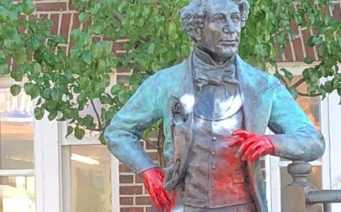<p>RED HANDED The statue depicting Sir John A Macdonald outside the Picton Library was defaced by unknown person(s) with red paint some time in the early morning hours of June 29. (Submitted Photo)</p>
