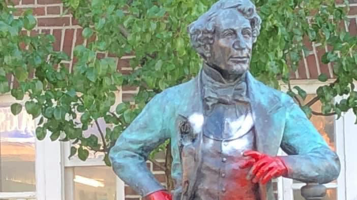 <p>RED HANDED The statue depicting Sir John A Macdonald outside the Picton Library was defaced by unknown person(s) with red paint some time in the early morning hours of June 29. (Submitted Photo)</p>
