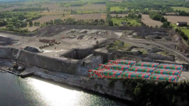 <p>A artist’s rendition of cargo containers at the shoreline at Picton Terminals from 2020. (Picton Terminals website screen grab)</p>
