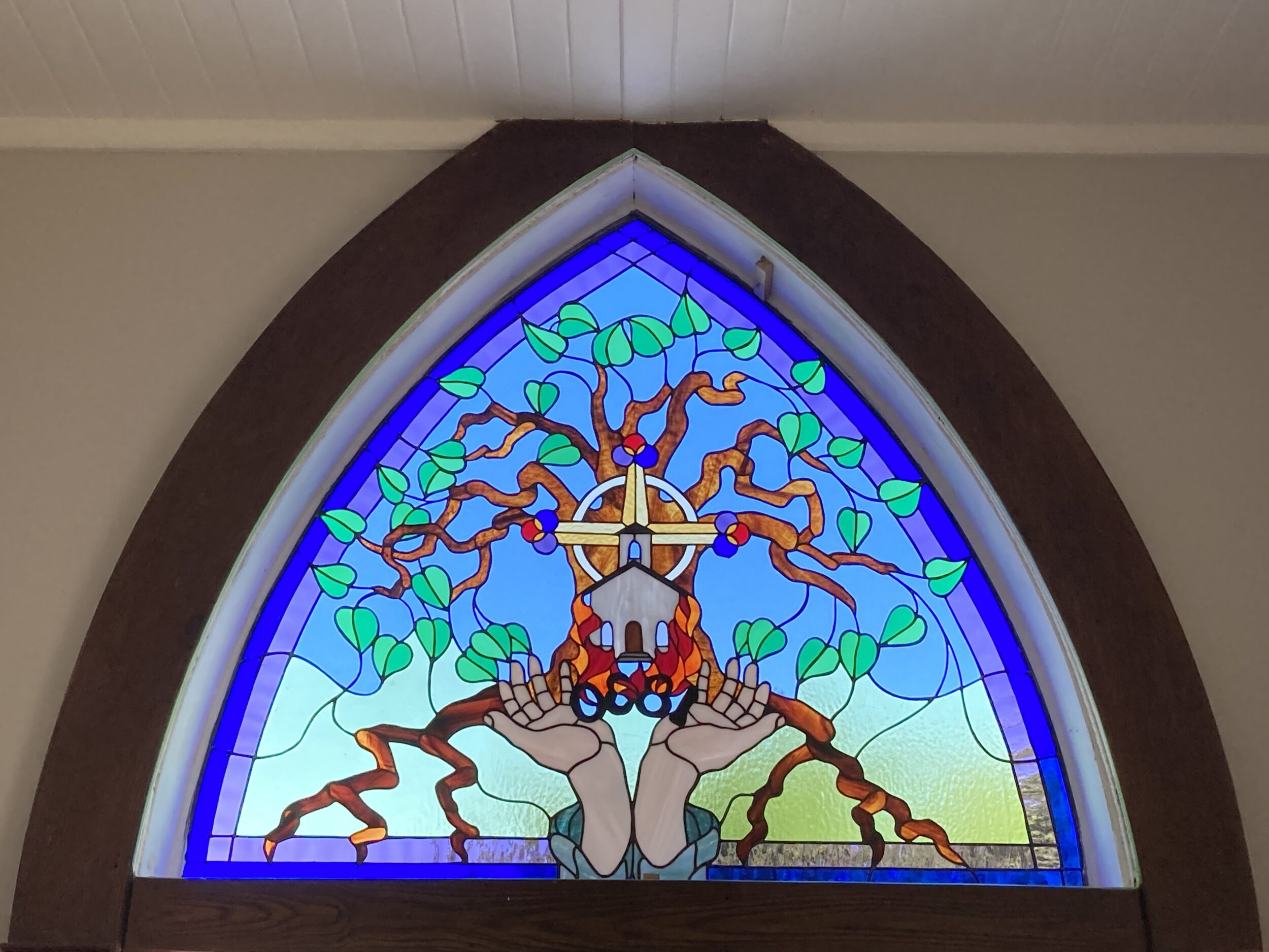 <p>FROM THE ASHES- A memorial stained glass window in the sanctuary of St. Phillip’s tells of the fire of 1920 and the church’s theme of growing on the vine. A centennial celebration of the reopening of St. Phillip’s is tentatively planned for November 15, 2020.(Submitted photo)</p>
