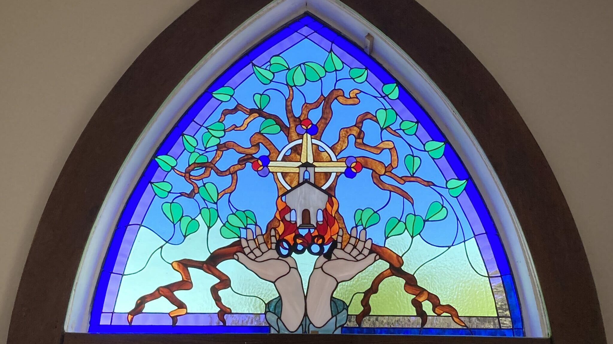 <p>FROM THE ASHES- A memorial stained glass window in the sanctuary of St. Phillip&#8217;s tells of the fire of 1920 and the church&#8217;s theme of growing on the vine. A centennial celebration of the reopening of St. Phillip&#8217;s is tentatively planned for November 15, 2020.(Submitted photo)</p>
