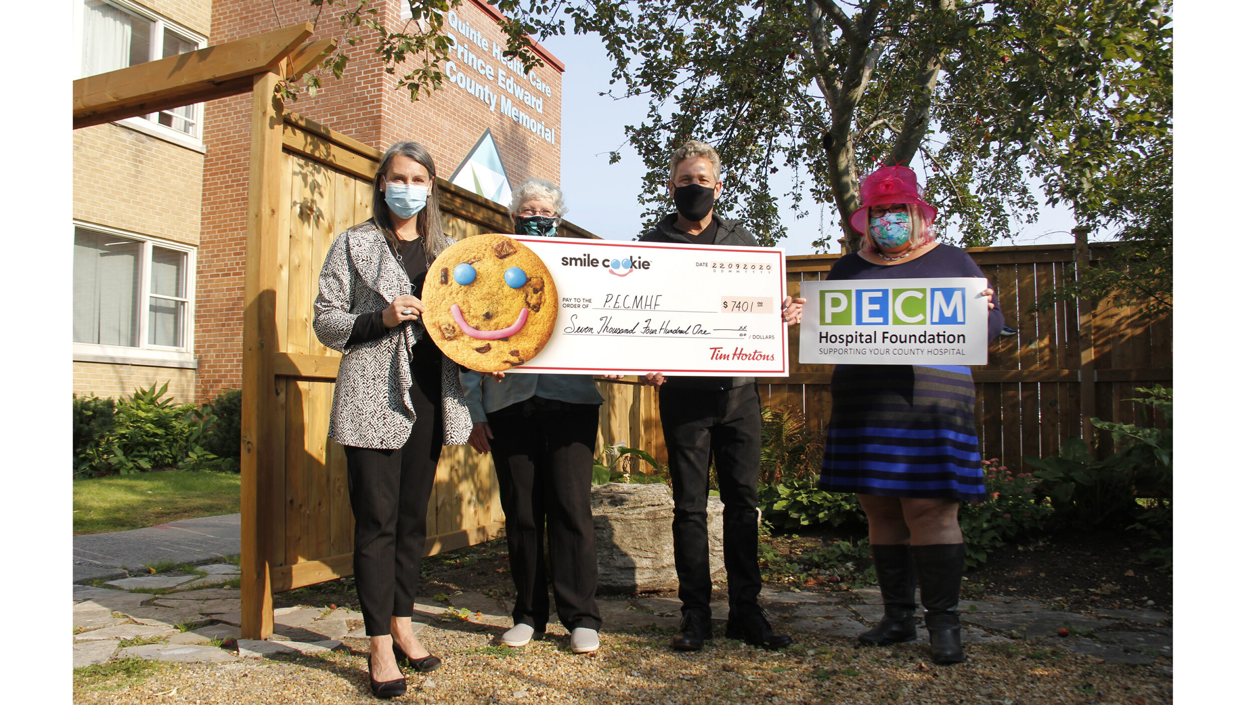<p>SMILING UNDERNEATH (From left) Shannon Coull, executive director of the PECMH Foundation, Sherry Tait, a volunteer board member with the PECMH Foundation, Paul Massey, owner of the Picton and Wellington Tim Hortons and Briar Boyce, senior development officer with the PECMH Foundation are pictured at PECMH on Tuesday as Tim Hortons donated $7,401 from the Smile Cookie Campaign proceeds from both Picton and Wellington Tim Hortons to the PECMH Foundation. (Desirée Decoste/Gazette staff)</p>
