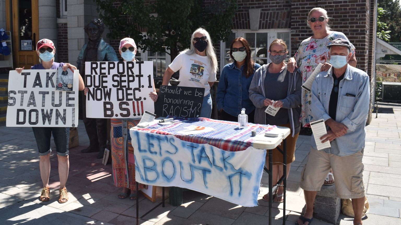<p>ASKING QUESTIONS (From Left) Annette McIntosh, Angela Lammes, Christine Renaud, Fern Dias, Shannon Helm, Sharon Hart and Paul Allen hold their own court in front of the Picton Library last month.  (Jason Parks/Gazette Staff)</p>

