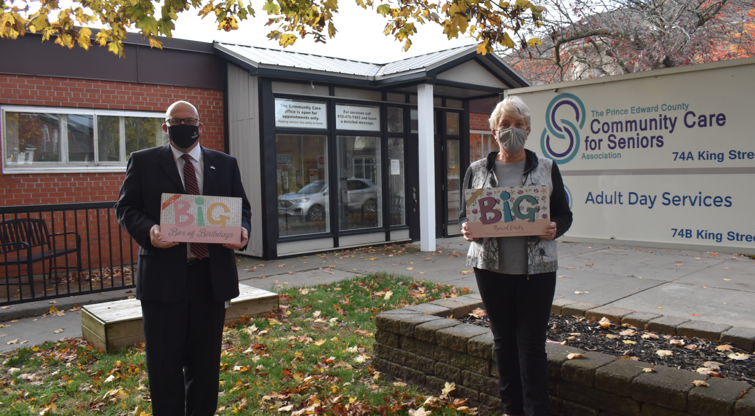 <p>GOING BIG- County of Prince Edward Mayor Steve Ferguson and Chair of the Board of the Prince Edward Community Care for Seniors Association Barb Proctor show off the big boxes of cards that are available to purchase through Community Care. (Jason Parks/Gazette Staff)</p>

