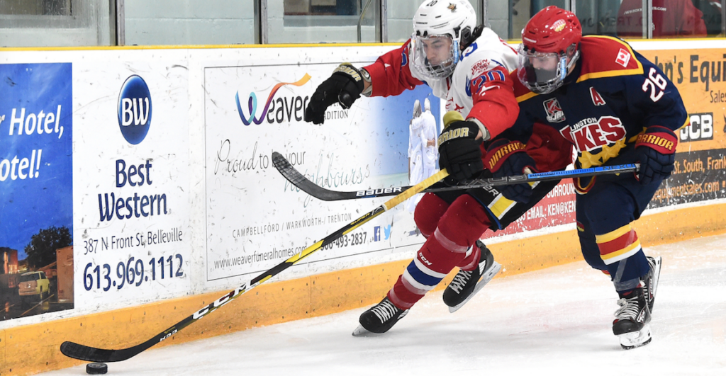 <p>Wellington’s Ben Woodhouse and Trenton’s Brannon Butler battle along the boards during Game 7 of the Hasty P’s Cup at Duncan MacDonald Memorial Gardens on Friday. (Andy Corneau/OJHL Images)</p>
