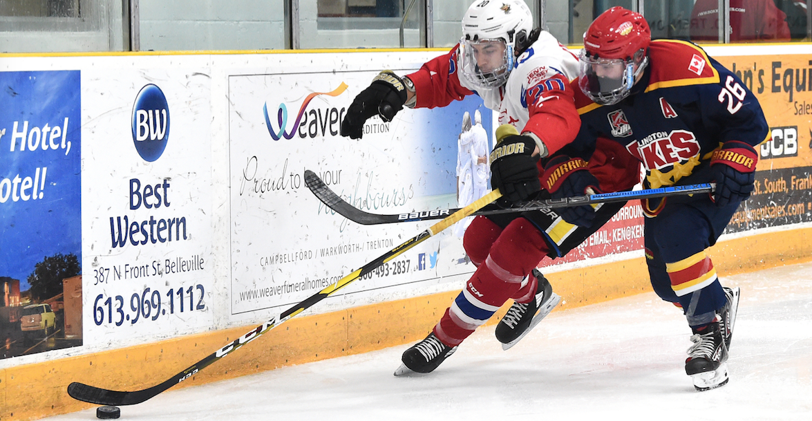 <p>Wellington’s Ben Woodhouse and Trenton’s Brannon Butler battle along the boards during Game 7 of the Hasty P’s Cup at Duncan MacDonald Memorial Gardens on Friday. (Andy Corneau/OJHL Images)</p>

