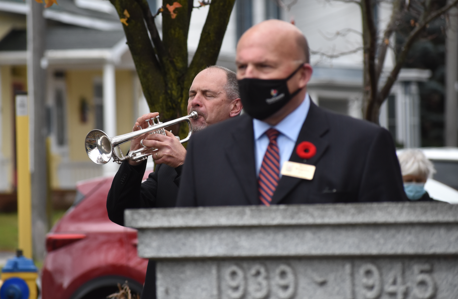 <p>Kevin Gannon plays the Last Post while County of Prince Edward Mayor Steve Ferguson honours Canada’s war dead on Remembrance Day last week. (Jason Parks/Gazette Staff)</p>
