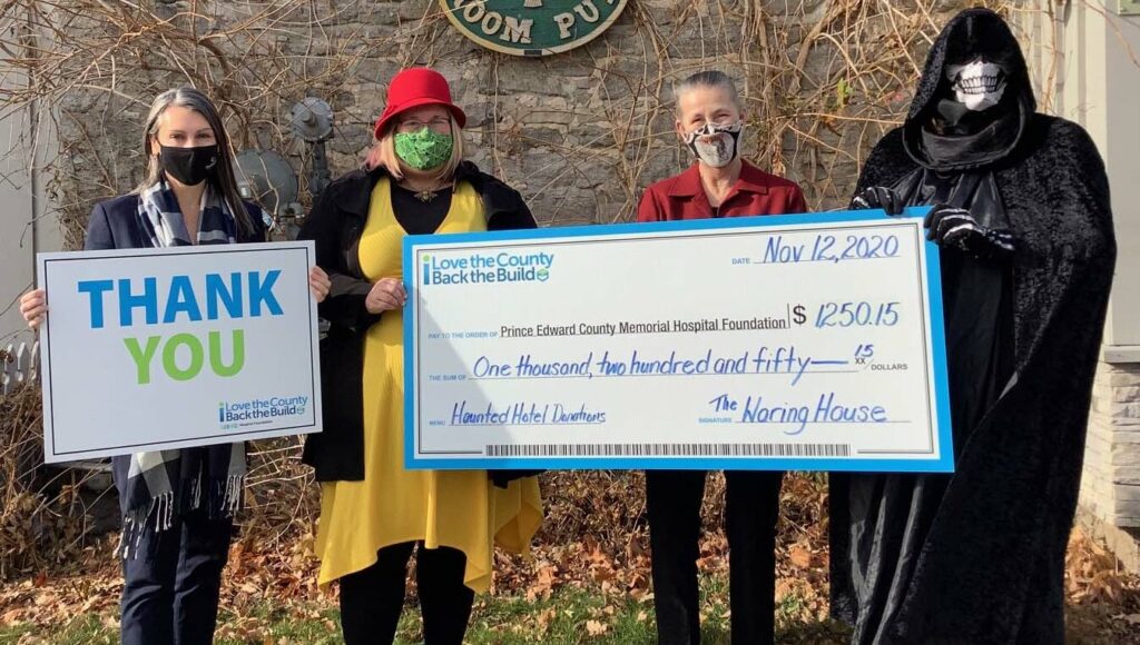 <p>HALLOWED DONATION (From left) Shannon Coull, executive director of the PECMH Foundation; Briar Boyce, senior development officer with the PECMH Foundation; Norah Rogers, innkeeper at the Waring House and Krista Tevlin, haunted hotel coordinator.<br />
(Photo by Judy Sanders)</p>
