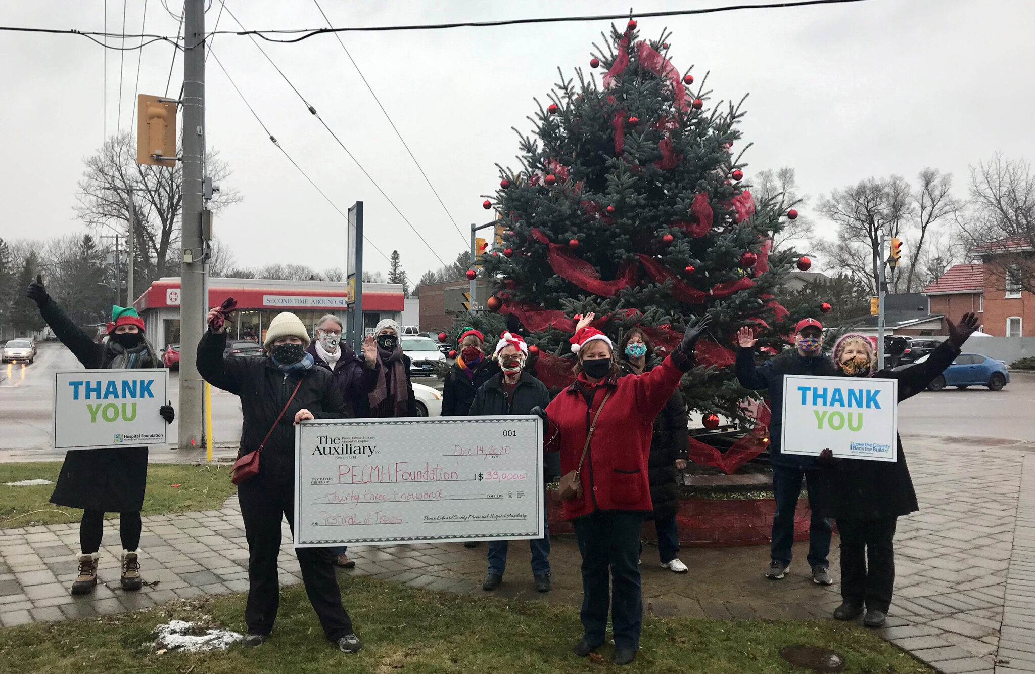<p>FEELING FESTIVE- Despite not being to host a physical 2020 Festival of Trees event, the Prince Edward County Memorial Hospital Auxiliary was   still able to generate over $30,000 for capital equipment expenditures at the local Hospital. Pictured from left at the Picton cenotaph Monday are: Shannon Coull, executive director of the PECMH Foundation; Auxiliary Members, Sharon Morcom; Denise Linnett; Dorothy Vincent; Carol Harvey; Fran Donaldson; Liz Jones, Festival of Trees chairperson; Judy Anderson; Jack Starkey and Auxiliary President, Cathy Starkey. (Briar Boyce Photo)</p>
