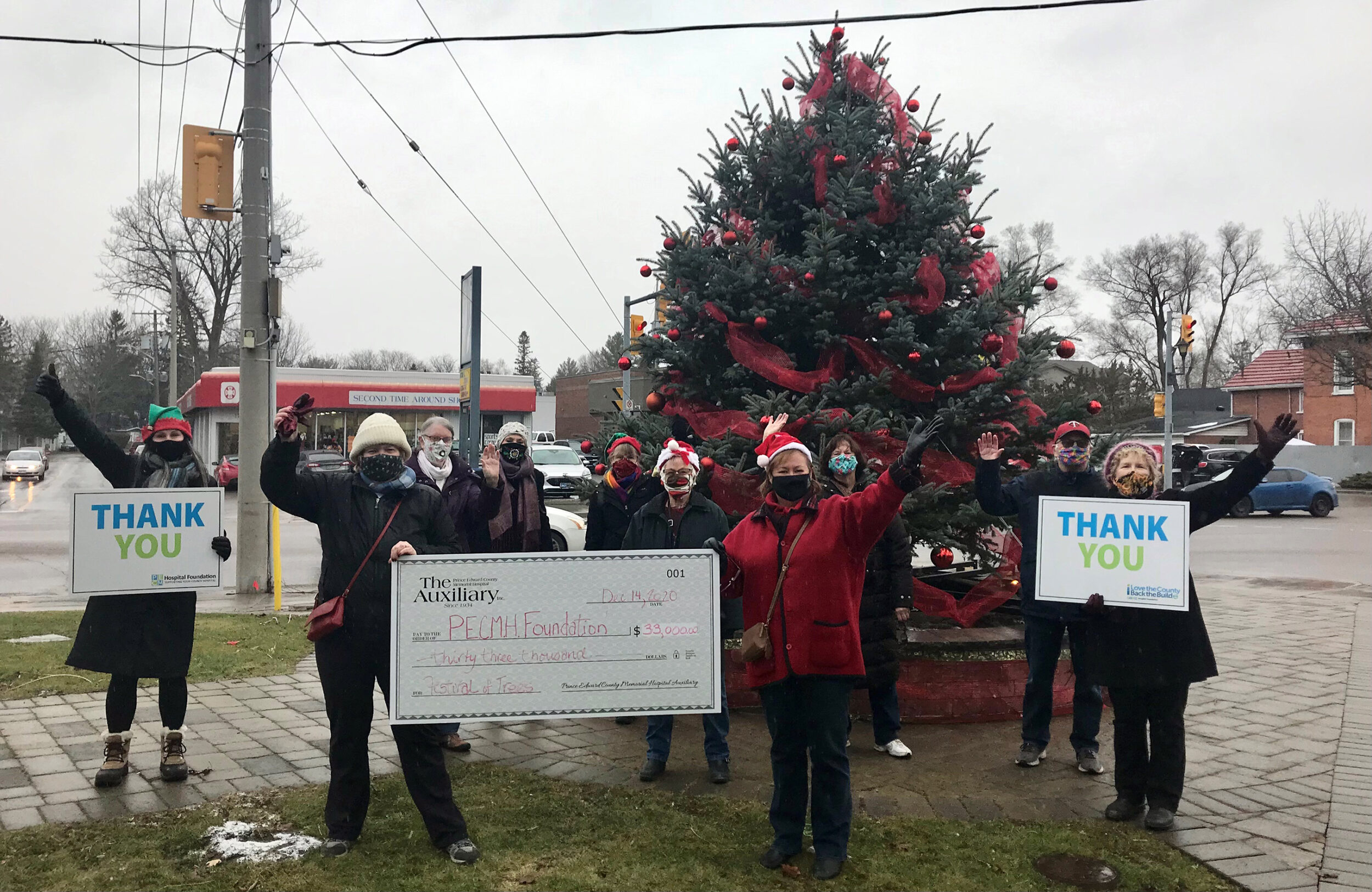 <p>FEELING FESTIVE- Despite not being to host a physical 2020 Festival of Trees event, the Prince Edward County Memorial Hospital Auxiliary was   still able to generate over $30,000 for capital equipment expenditures at the local Hospital. Pictured from left at the Picton cenotaph Monday are: Shannon Coull, executive director of the PECMH Foundation; Auxiliary Members, Sharon Morcom; Denise Linnett; Dorothy Vincent; Carol Harvey; Fran Donaldson; Liz Jones, Festival of Trees chairperson; Judy Anderson; Jack Starkey and Auxiliary President, Cathy Starkey. (Briar Boyce Photo)</p>
