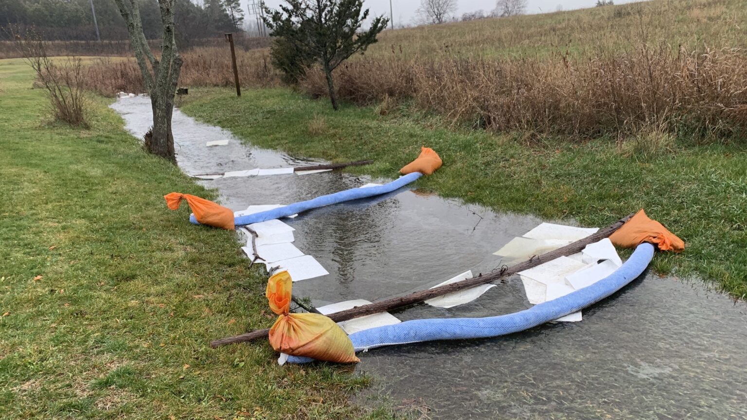 <p>Protective booms and absorbent drop sheets collect an oily substance from a nearby solar farm build in Athol. (Submitted Photo) </p>
