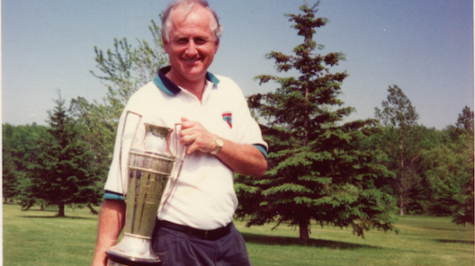 <p>Famed local sportsman Carl Stacey with the Quinte Cup. Stacey once pitched a 19 inning, complete game win and hit a home run in a 1966 softball contest with a broken left arm. (Stacey Family)</p>
