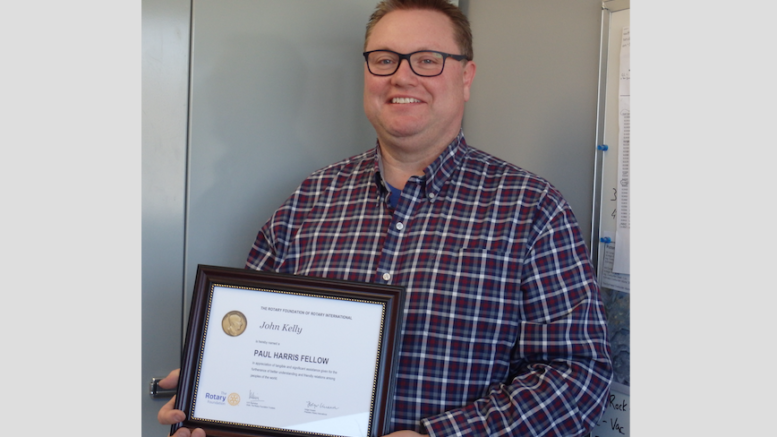 <p>THIS ONE’S A KEEPER- Minor Hockey and Baseball coach and executive volunteer John Kelly was awarded a Paul Harris Fellow award by the Rotary Club of Picton last week. Kelly has volunteered with both organizations for upwards of two decades. (Rotary Photo)</p>
